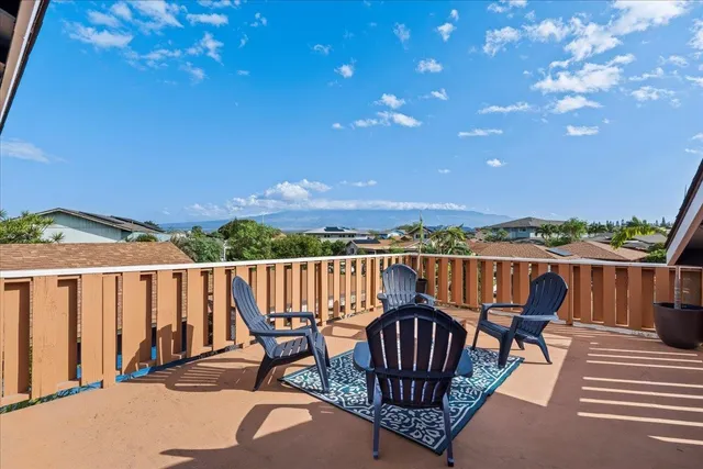 a view of a balcony with chairs