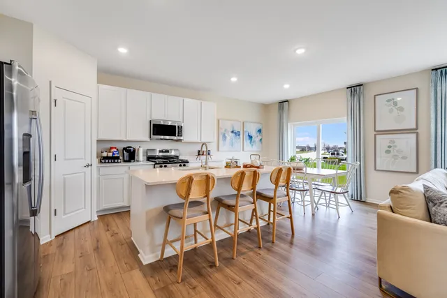 a view of kitchen with cabinets and stainless steel appliances