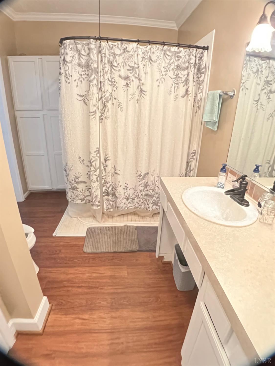 5396 Roark Mill Road Hurt, VA 24563 - Photo 15 of 25 a bathroom with a double vanity sink and a mirror