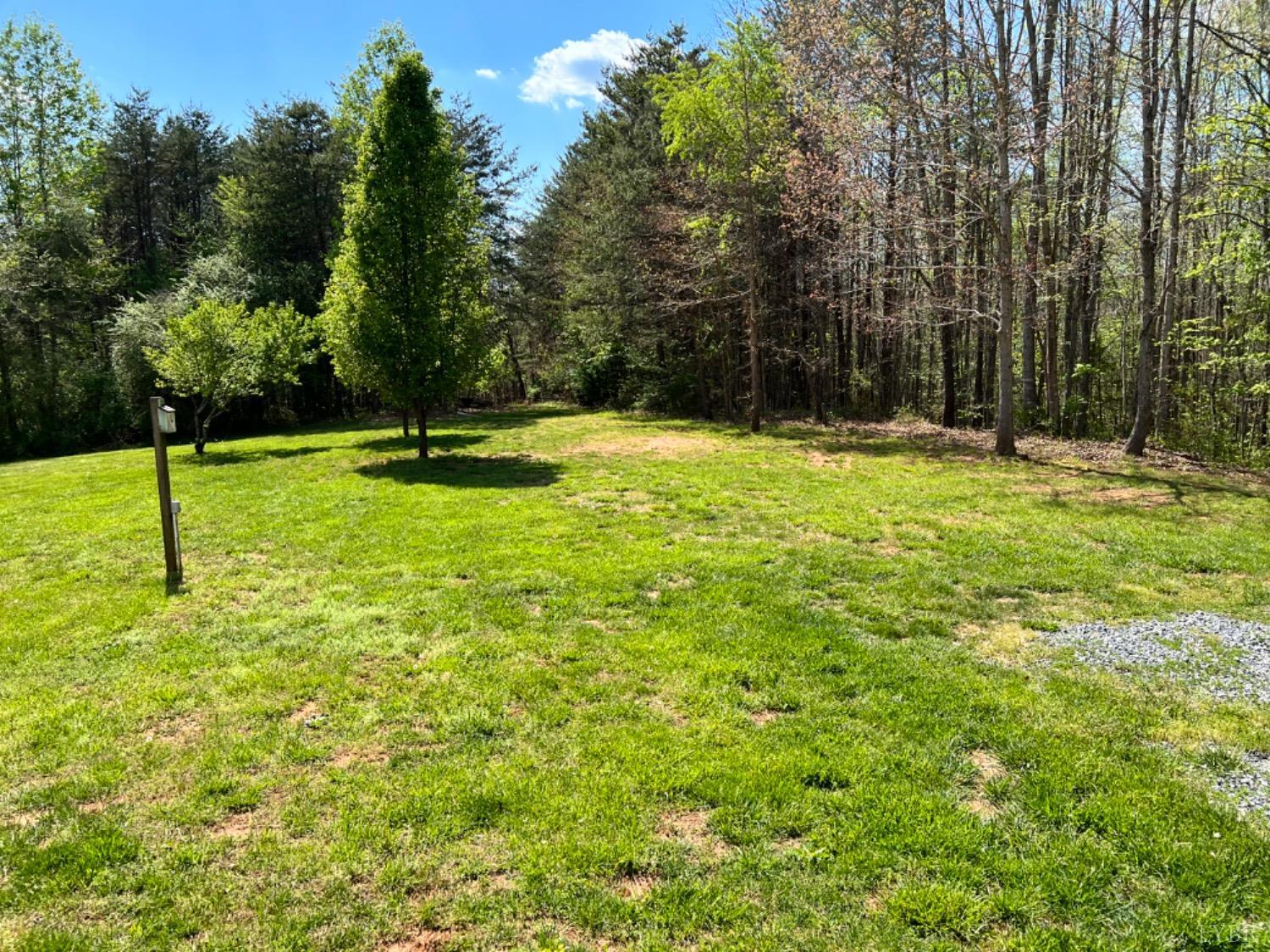5396 Roark Mill Road Hurt, VA 24563 - Photo 22 of 25 a swimming pool with some trees in the background