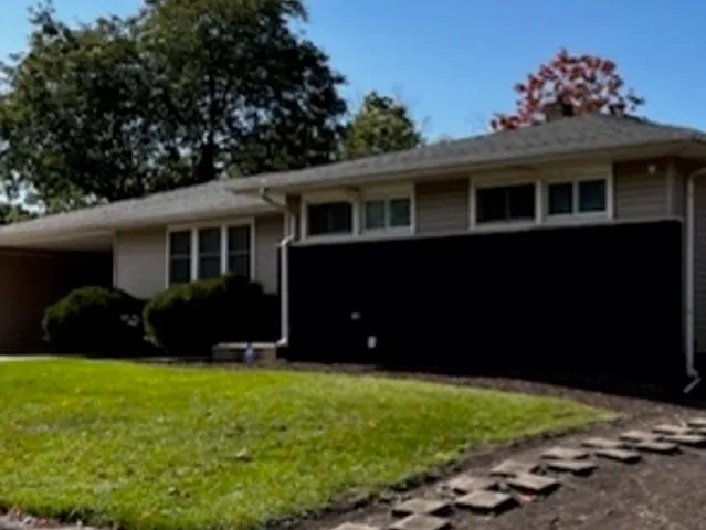 a view of a house with a yard