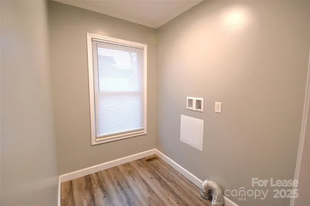 a view of room with window and hallway