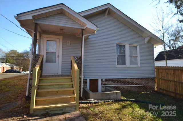 a front view of a house with stairs