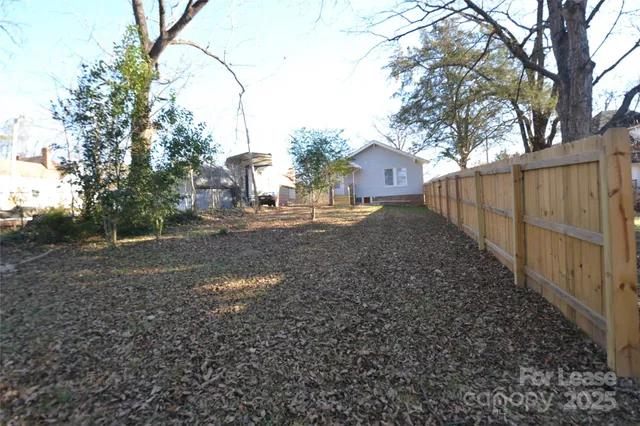 a backyard of a house with lots of green space