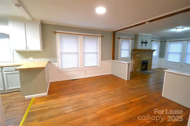 a view of a kitchen with microwave and cabinets