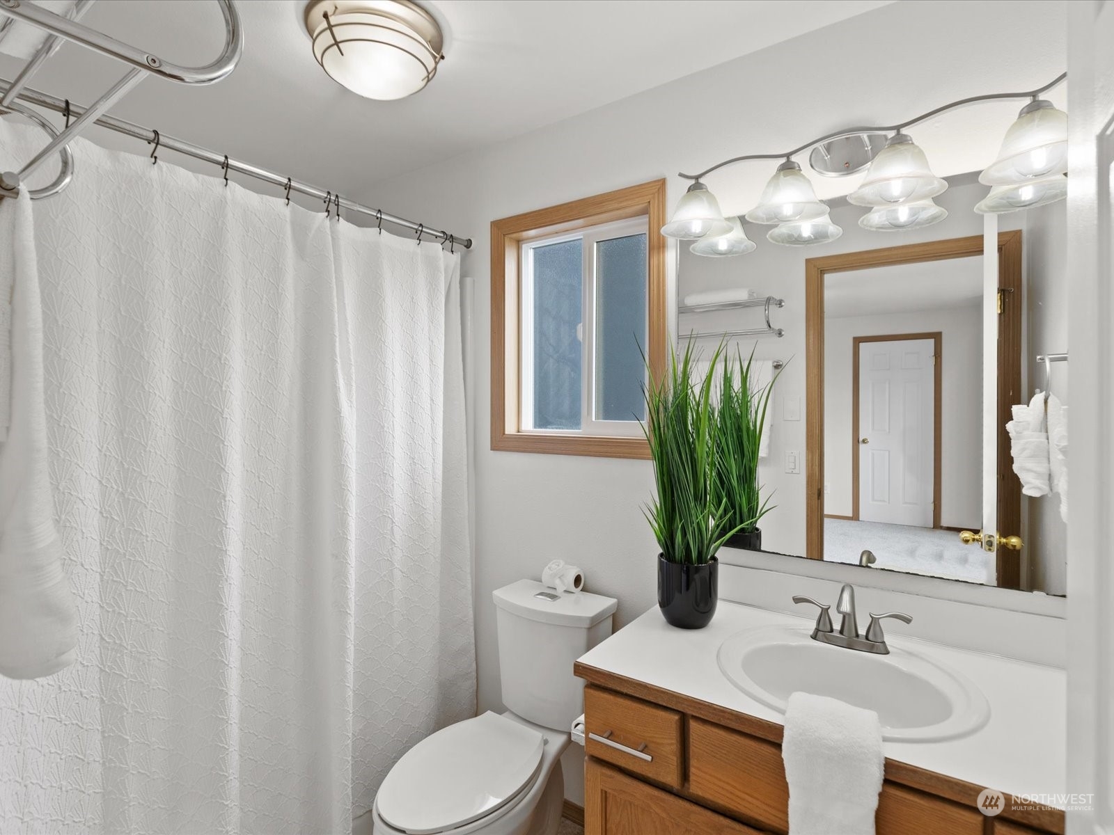 3415 189th Street Southeast Bothell, WA 98012 - Photo 18 of 33 a bathroom with a toilet a sink and mirror