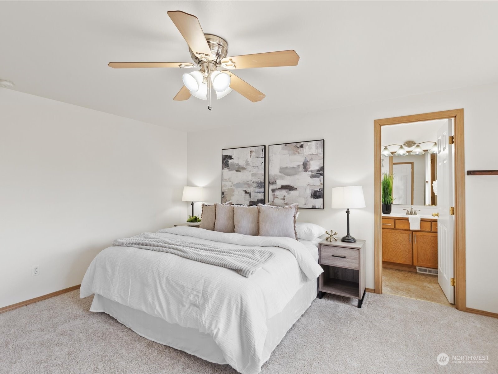 3415 189th Street Southeast Bothell, WA 98012 - Photo 19 of 33 a bedroom with a large bed and a chandelier