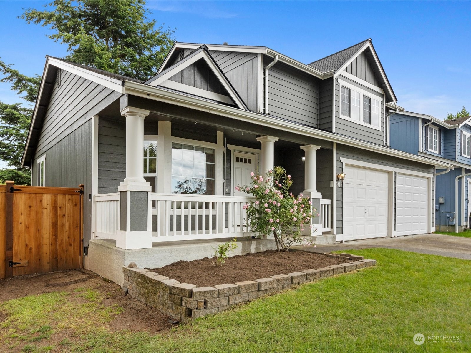 3415 189th Street Southeast Bothell, WA 98012 - Photo 2 of 33 a front view of a house with garden