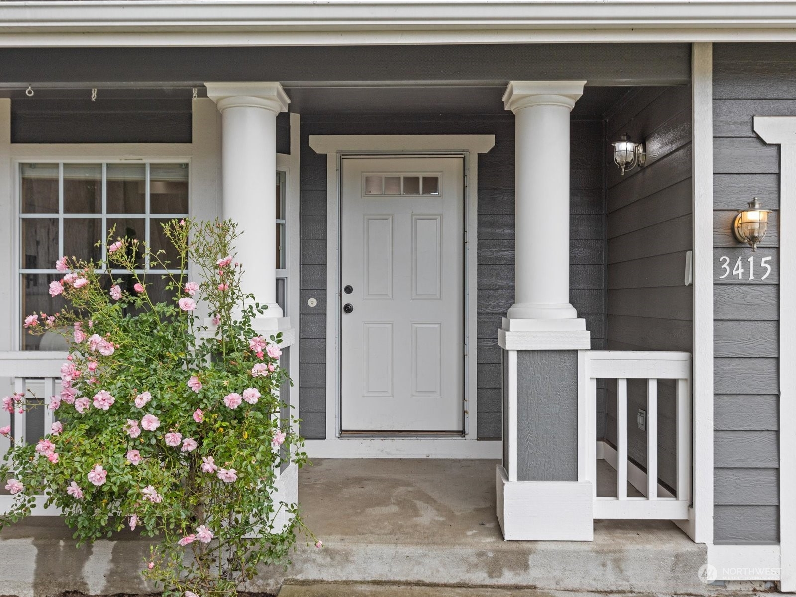 3415 189th Street Southeast Bothell, WA 98012 - Photo 3 of 33 a potted plant in front of a door