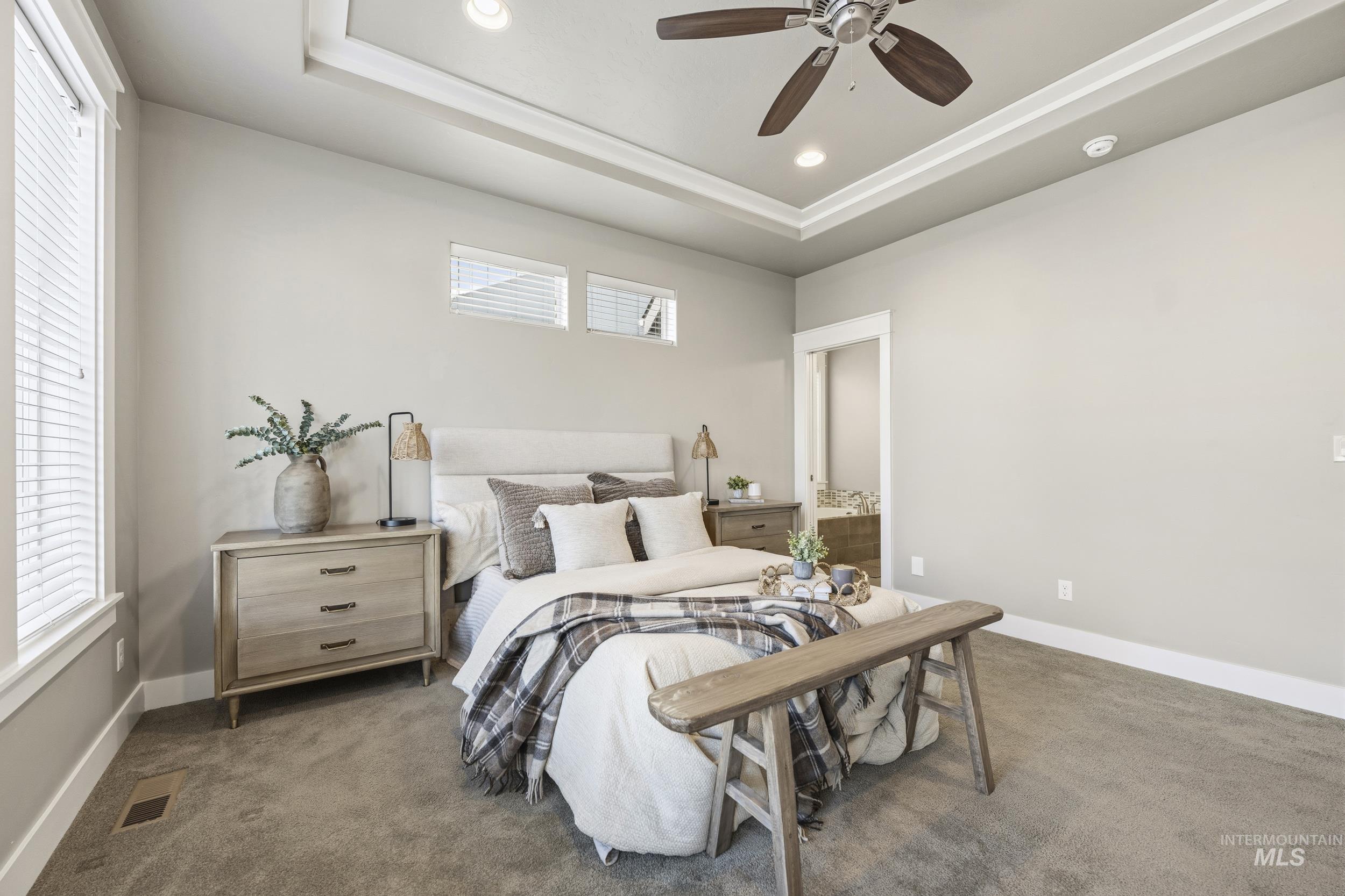 5699 North Fairborn Avenue Meridian, ID 83646 - Photo 17 of 30 Bedroom featuring a tray ceiling, recessed lighting, carpet, and a ceiling fan