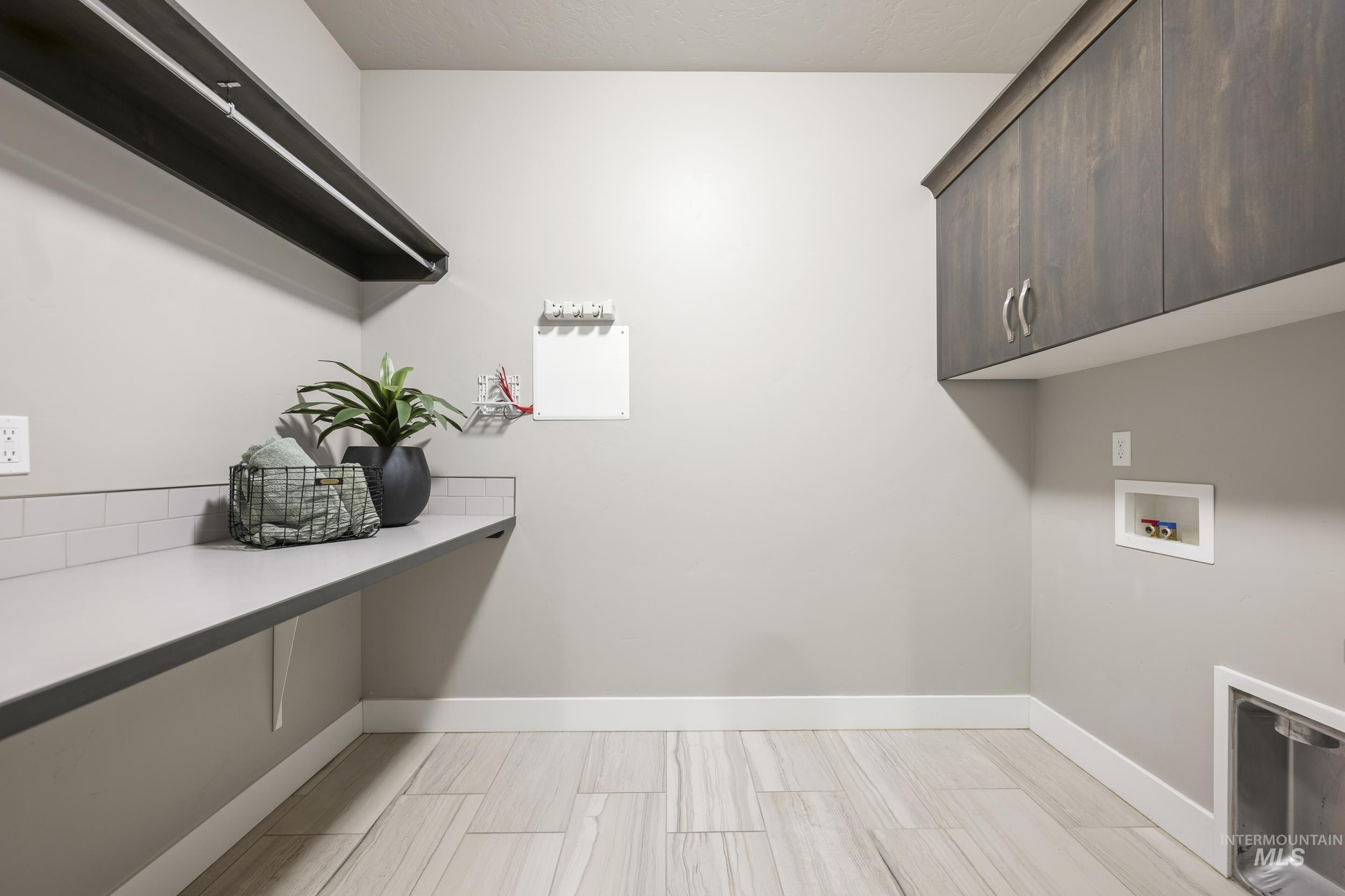 5699 North Fairborn Avenue Meridian, ID 83646 - Photo 21 of 30 Laundry room featuring cabinet space and hookup for a washing machine