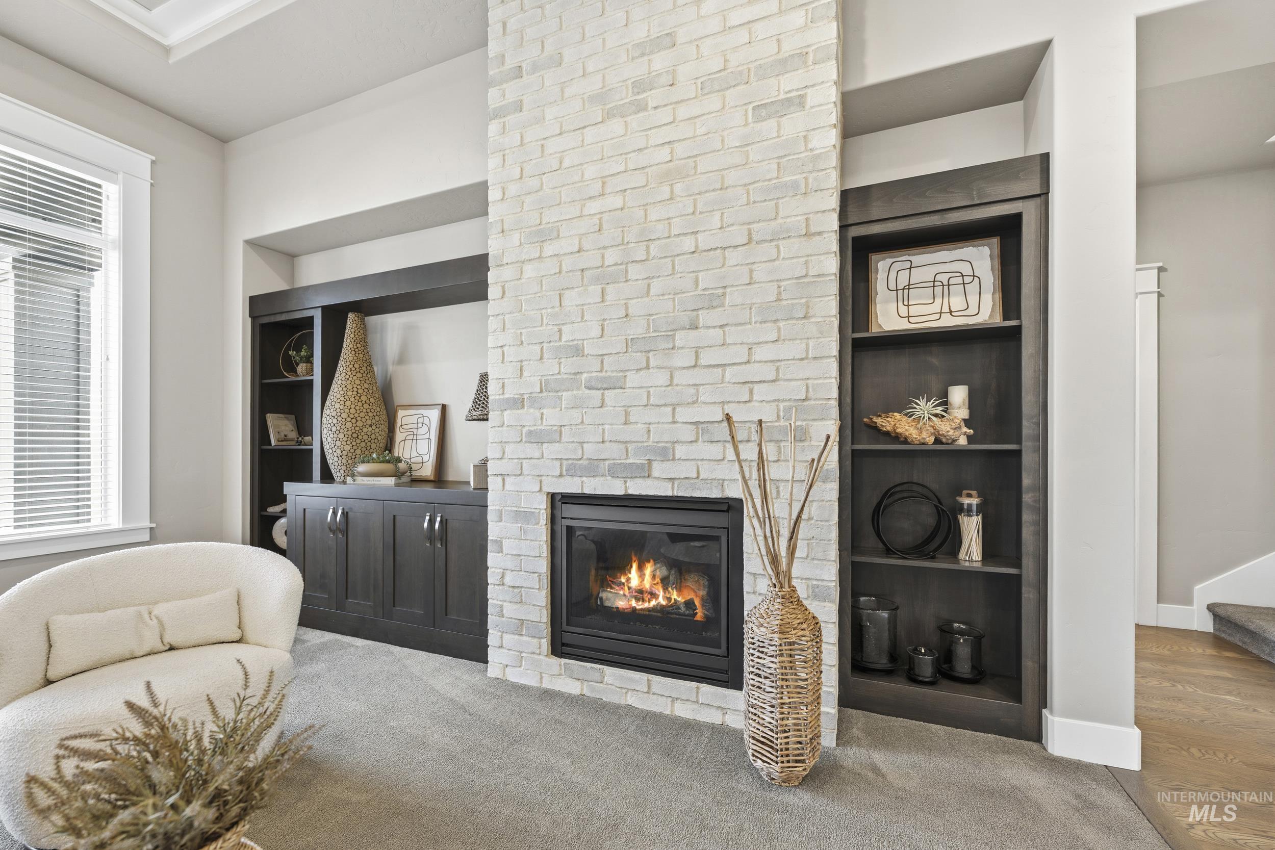 5699 North Fairborn Avenue Meridian, ID 83646 - Photo 7 of 30 Living area with carpet flooring, a brick fireplace, and built in features