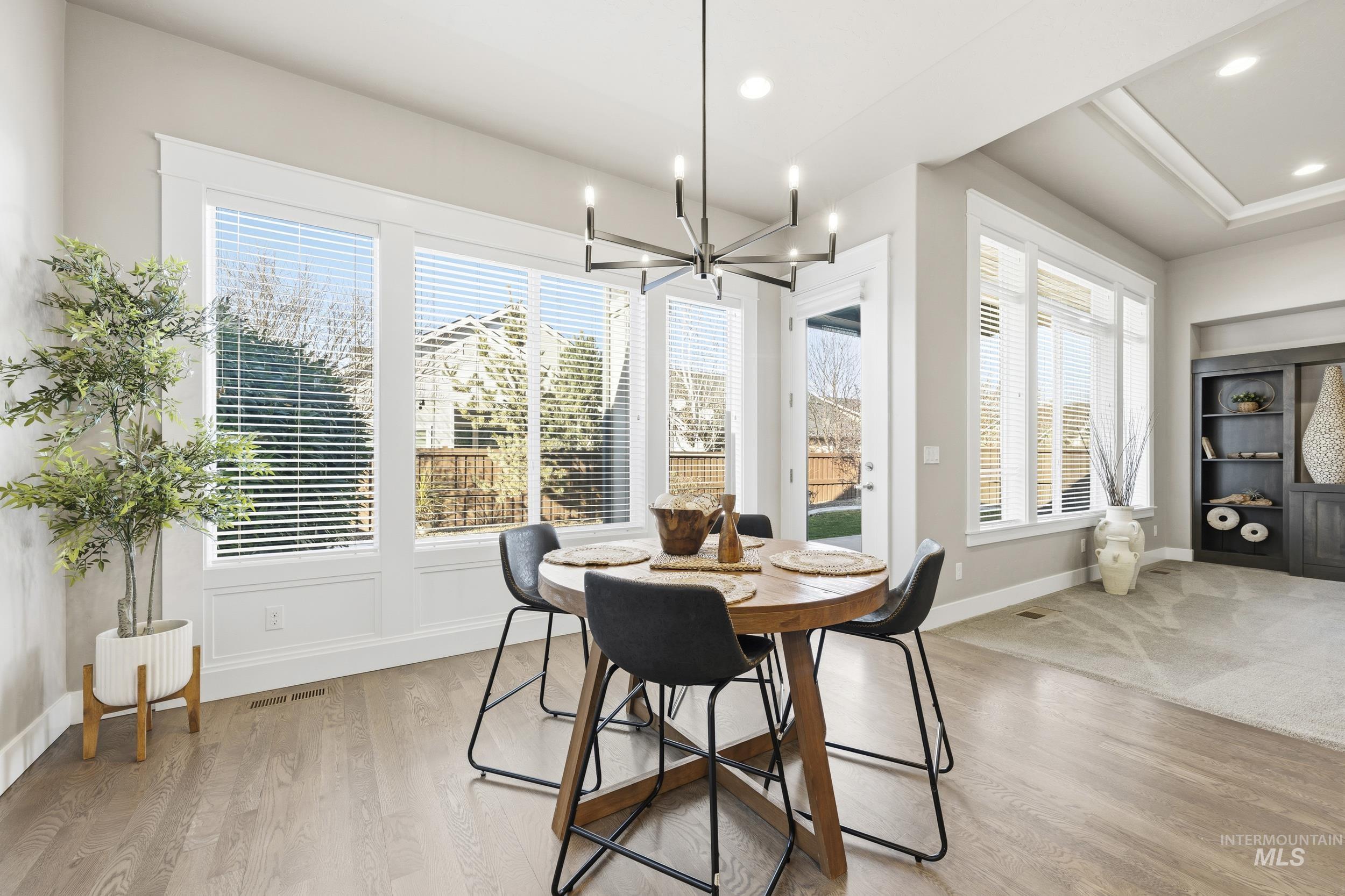 5699 North Fairborn Avenue Meridian, ID 83646 - Photo 8 of 30 Dining room featuring hanging lights and light wood-style flooring