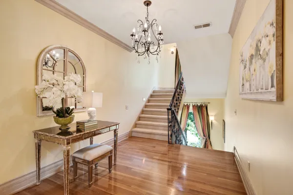 a living room with furniture fireplace and a large window