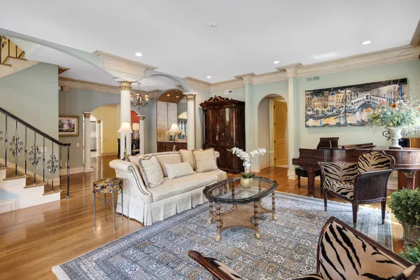 a kitchen with cabinets and chairs