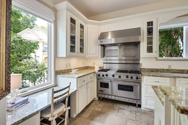 a bathroom with a double vanity sink toilet mirror and bathtub