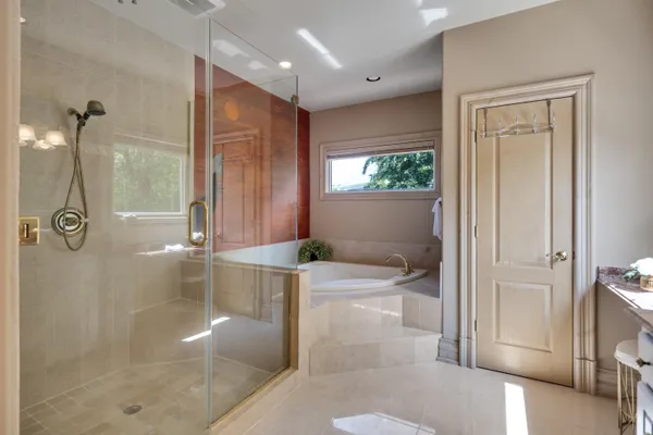 a bathroom with a granite countertop toilet a sink and a mirror