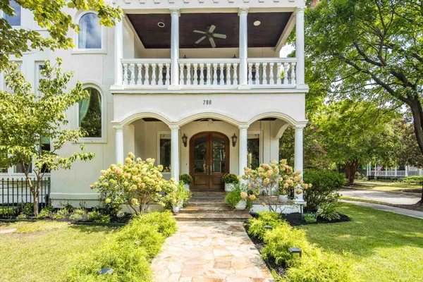 a front view of a house with garden