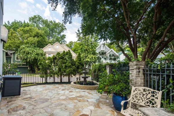 an aerial view of a house with a yard and lake view