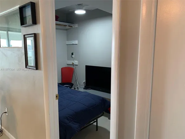 a view of hallway with wooden floor