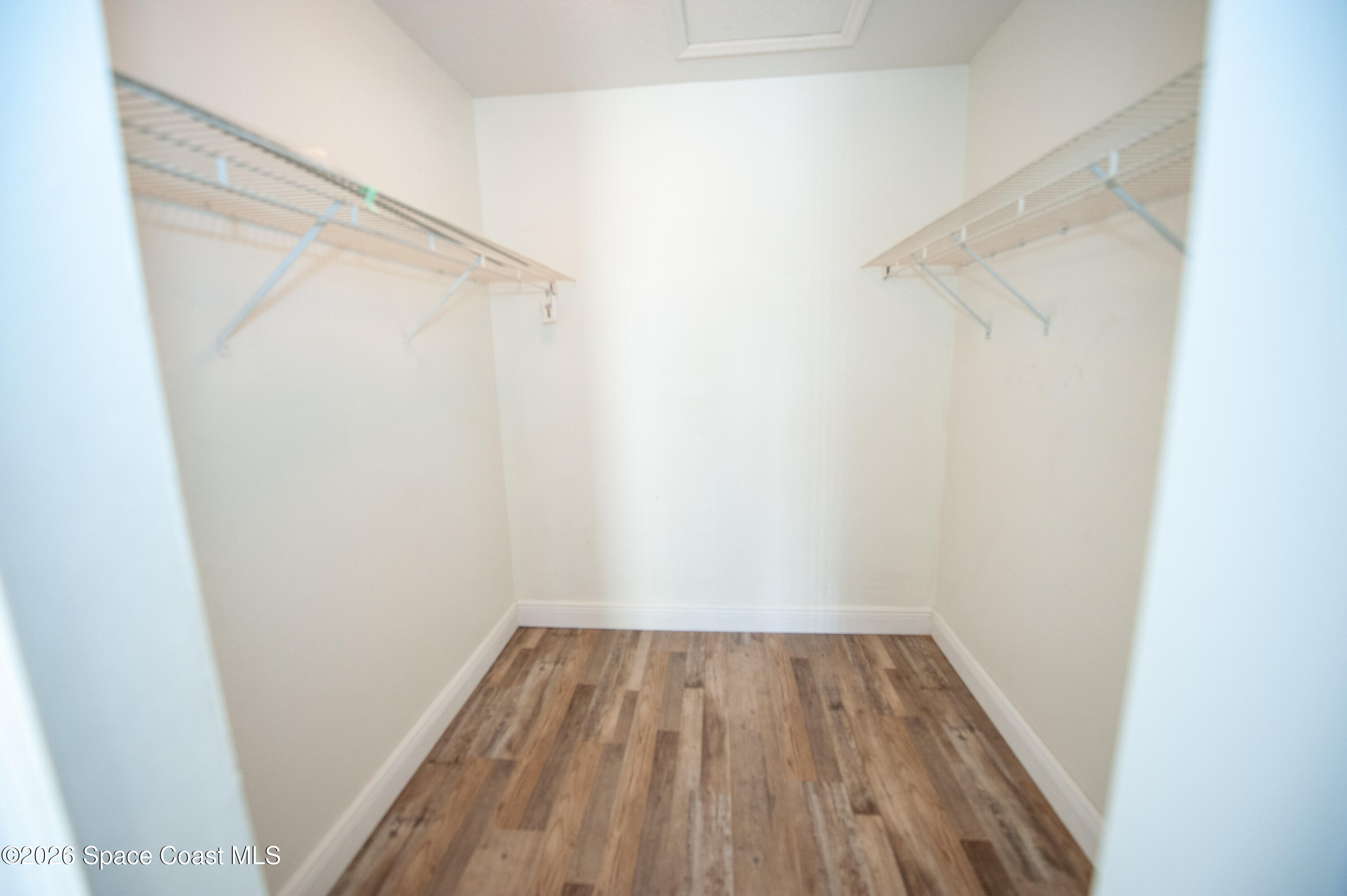 1942 Quail Ridge Court, Unit 504 Cocoa, FL 32926 - Photo 14 of 27 a view of a room with wooden floor