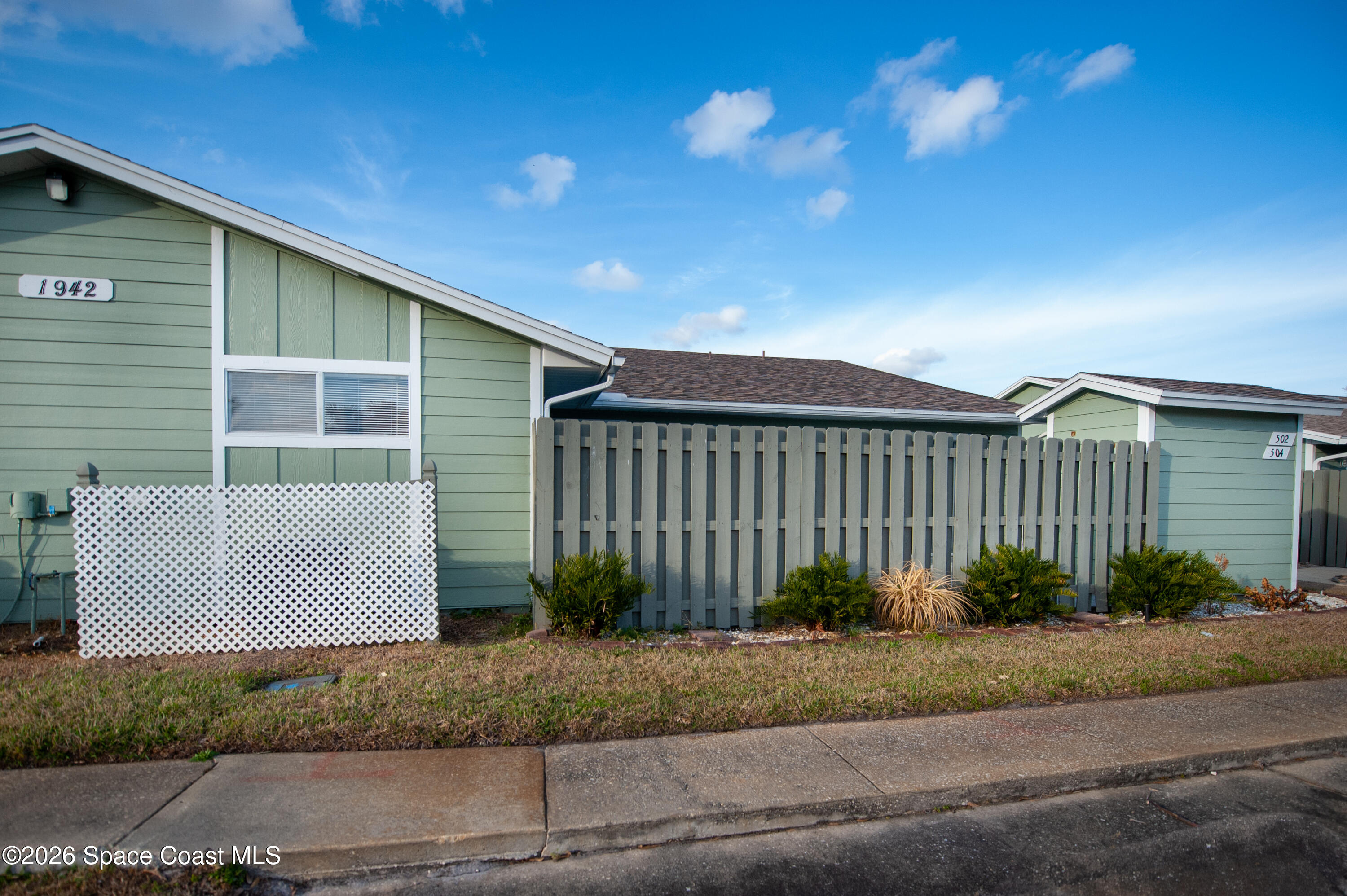 1942 Quail Ridge Court, Unit 504 Cocoa, FL 32926 - Photo 16 of 27 a front view of a house