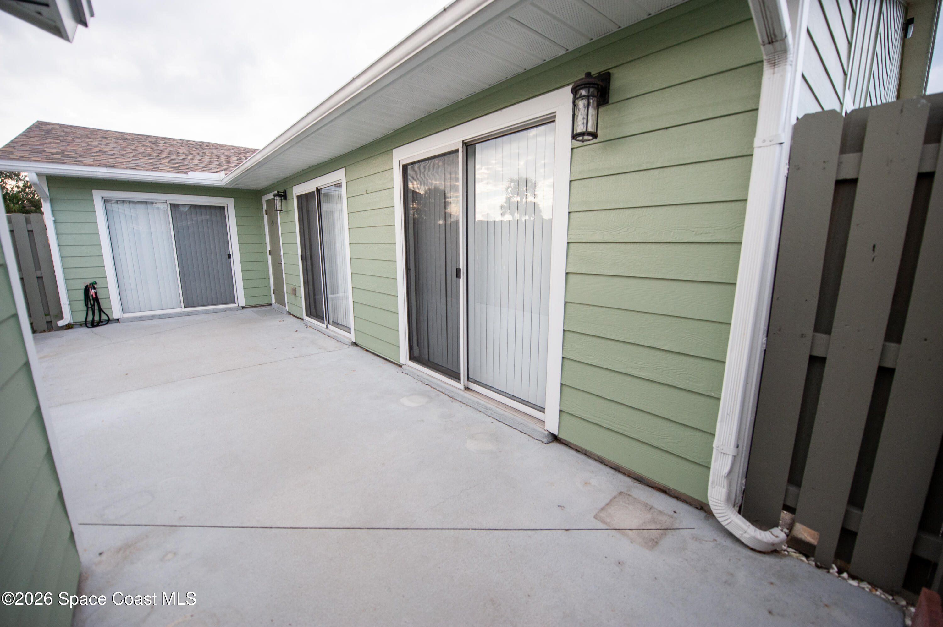 1942 Quail Ridge Court, Unit 504 Cocoa, FL 32926 - Photo 17 of 27 a view of backyard of the house