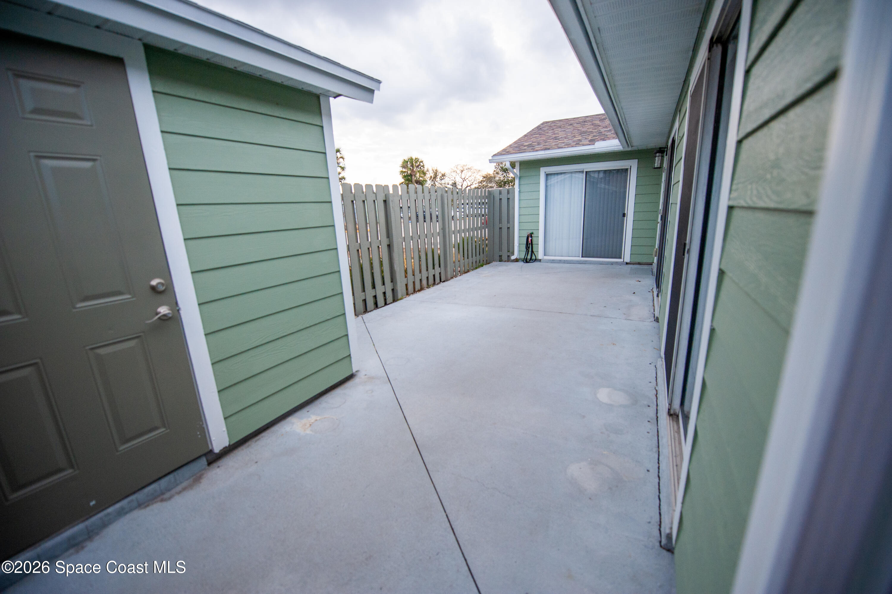 1942 Quail Ridge Court, Unit 504 Cocoa, FL 32926 - Photo 18 of 27 a view of a house with a backyard