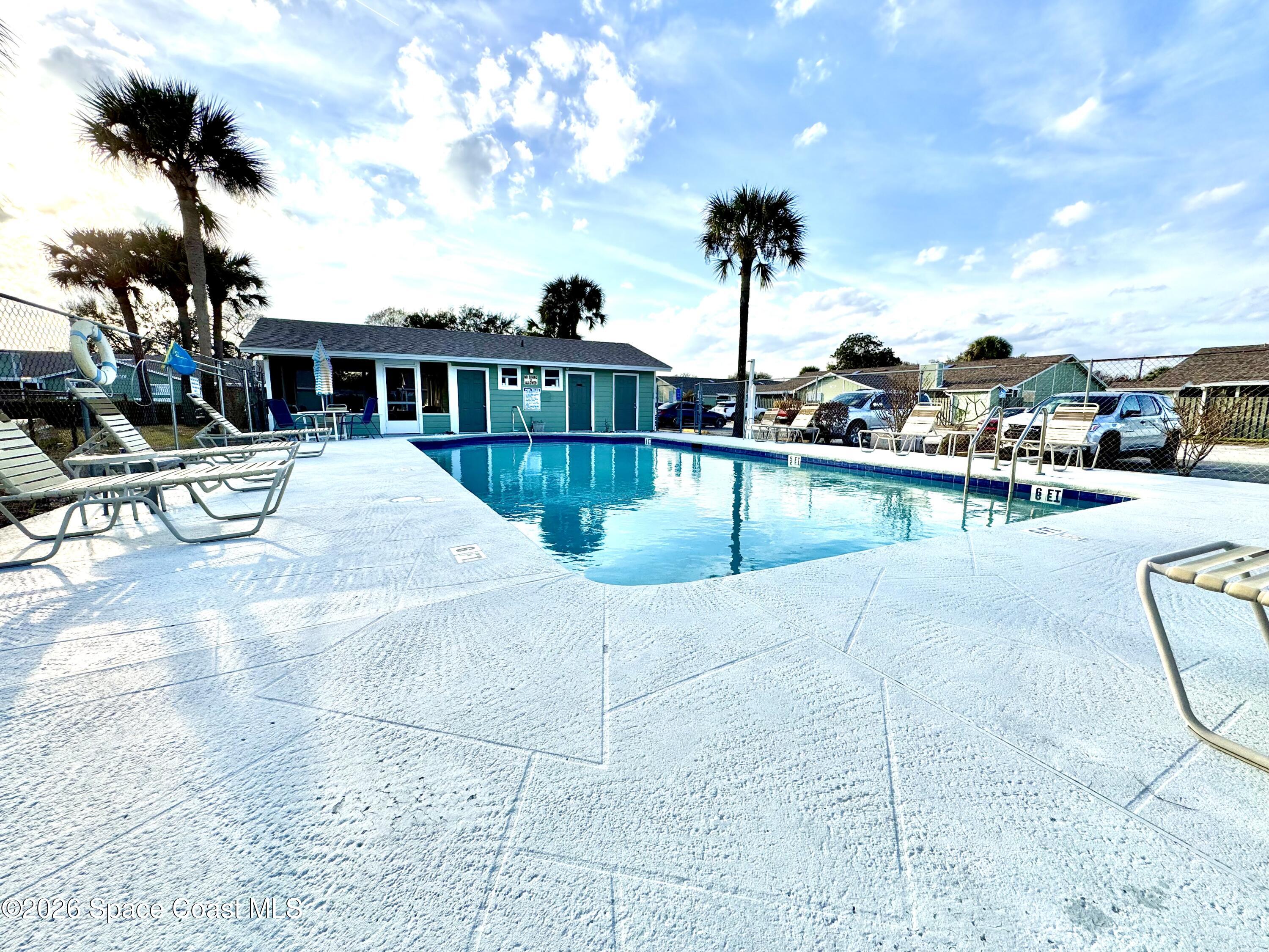 1942 Quail Ridge Court, Unit 504 Cocoa, FL 32926 - Photo 24 of 27 a view of a house with sitting area