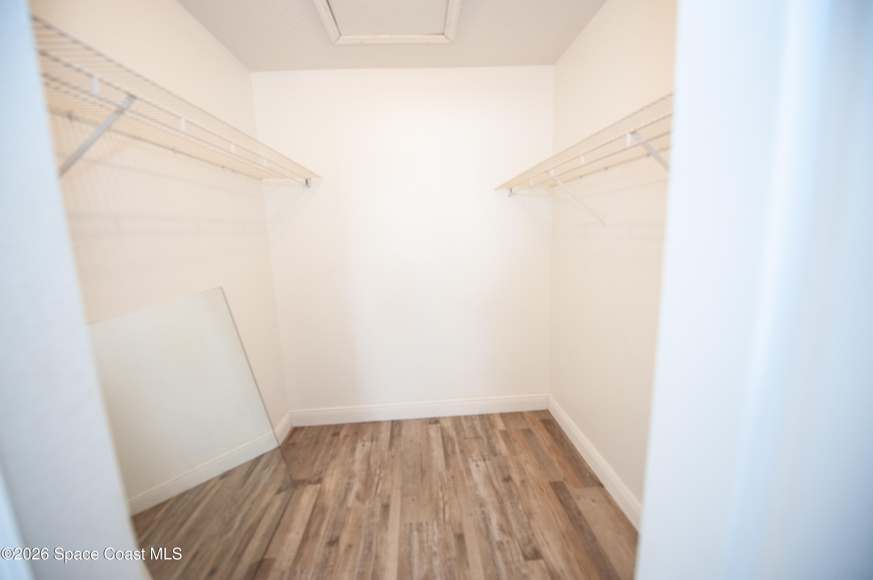 1942 Quail Ridge Court, Unit 504 Cocoa, FL 32926 - Photo 9 of 27 a view of a room with wooden floor
