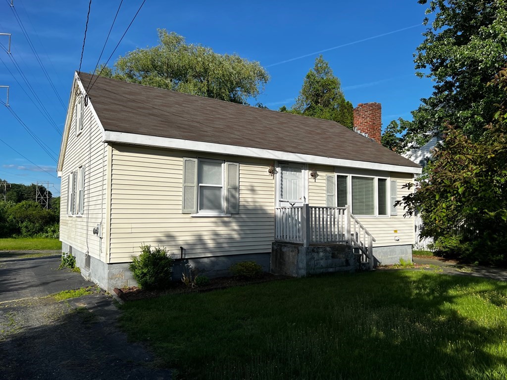 196 Boston Road Chelmsford, MA 01824 - Photo 1 of 26 a front view of a house with a yard