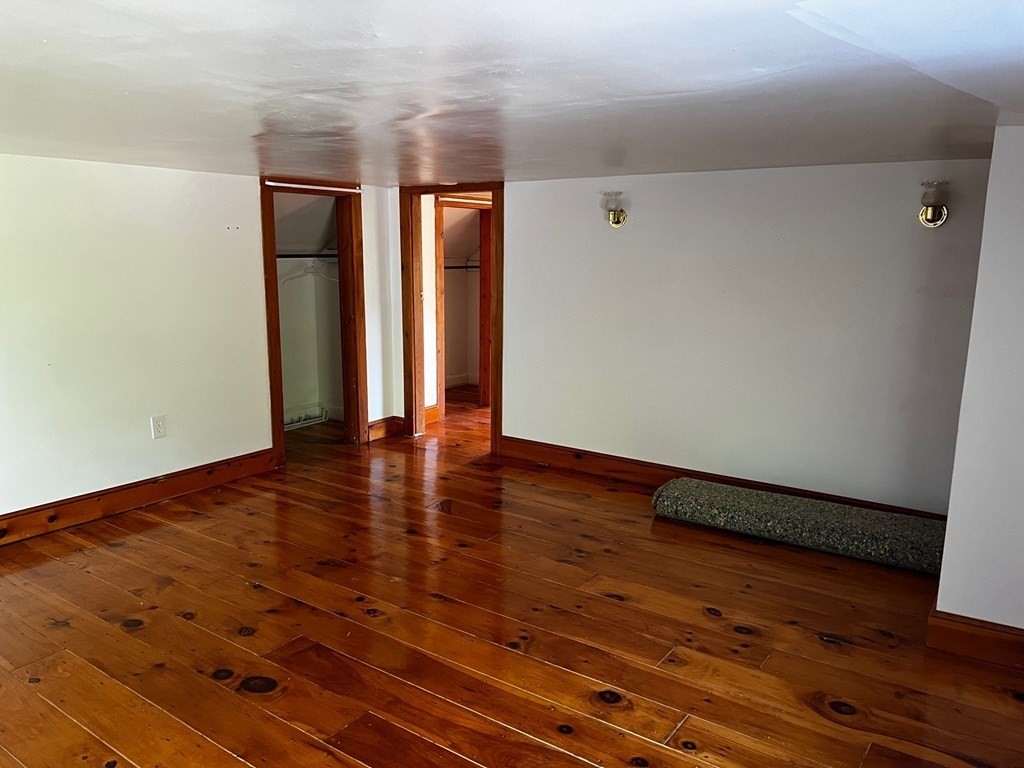 196 Boston Road Chelmsford, MA 01824 - Photo 19 of 26 a view of an empty room with wooden floor