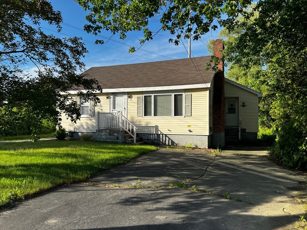 196 Boston Road Chelmsford, MA 01824 - Photo 2 of 26 front view of a house with a yard