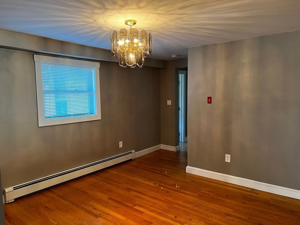 196 Boston Road Chelmsford, MA 01824 - Photo 7 of 26 a view of an empty room with wooden floor