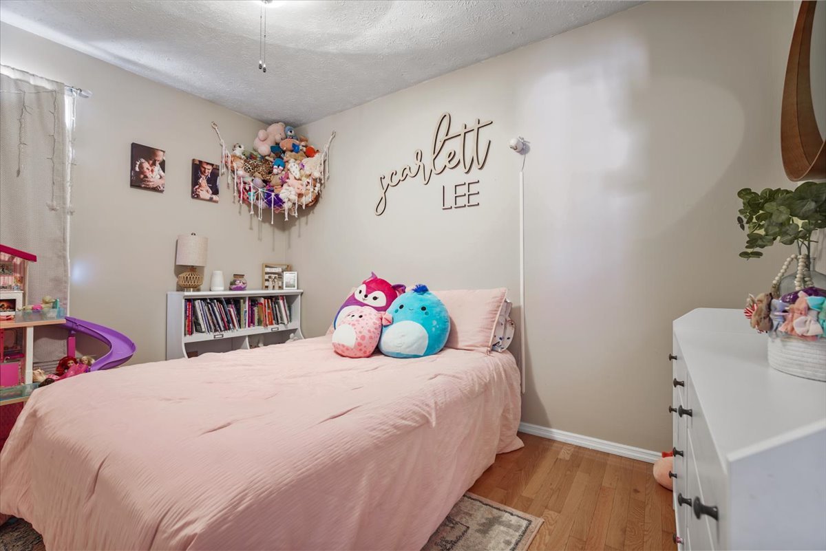 2 Yew Court Bloomington, IL 61701 - Photo 12 of 27 a bedroom with a bed and a dresser