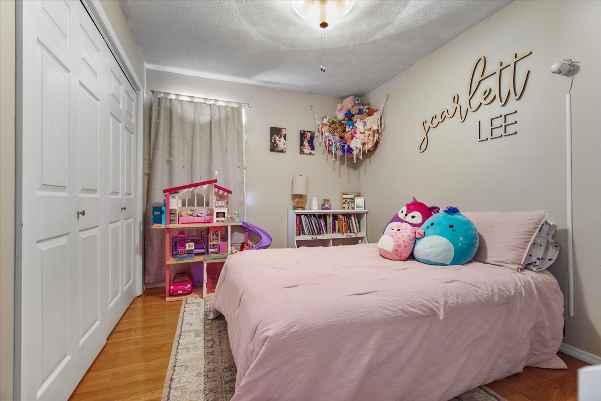 2 Yew Court Bloomington, IL 61701 - Photo 13 of 27 a bedroom with a bed and window