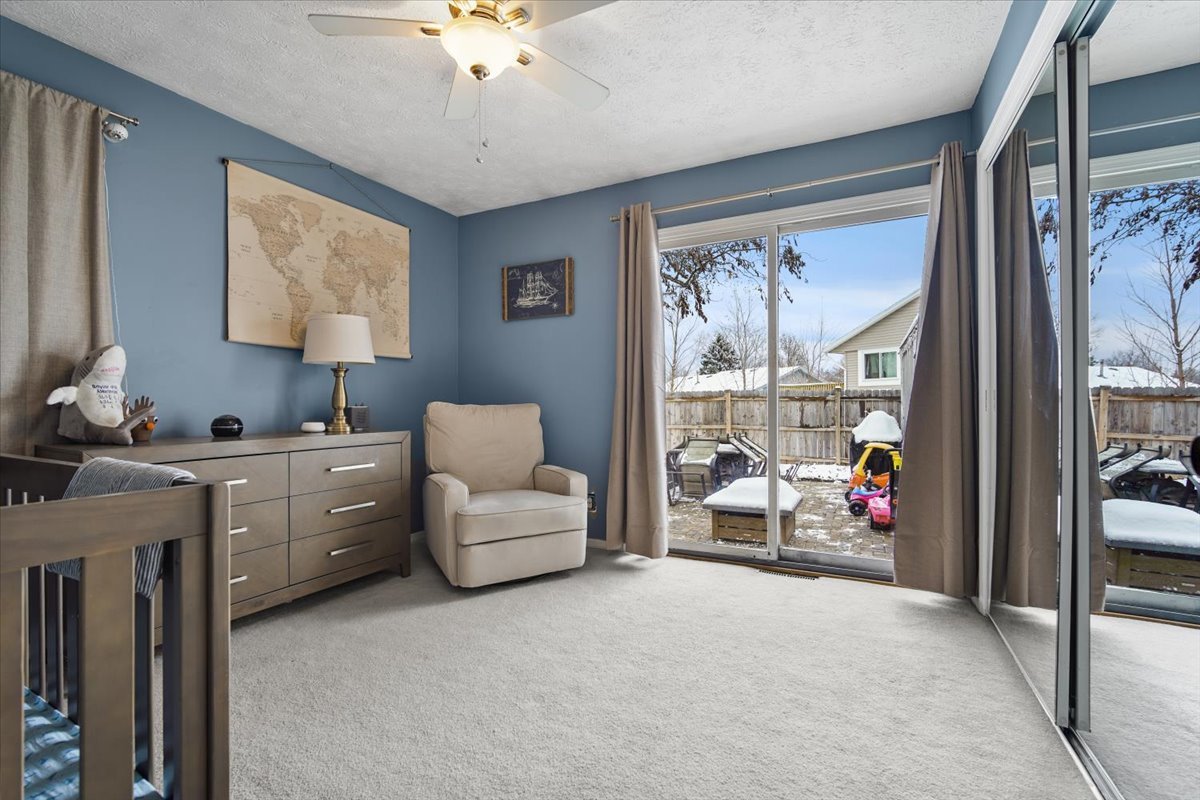 2 Yew Court Bloomington, IL 61701 - Photo 15 of 27 a living room with furniture and a large window