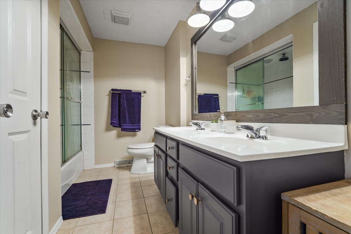 2 Yew Court Bloomington, IL 61701 - Photo 17 of 27 a bathroom with a sink and a mirror