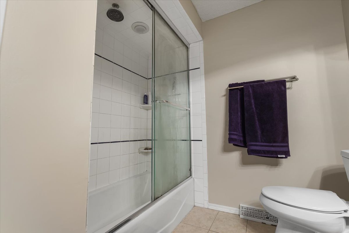 2 Yew Court Bloomington, IL 61701 - Photo 18 of 27 a bathroom with a toilet and a shower