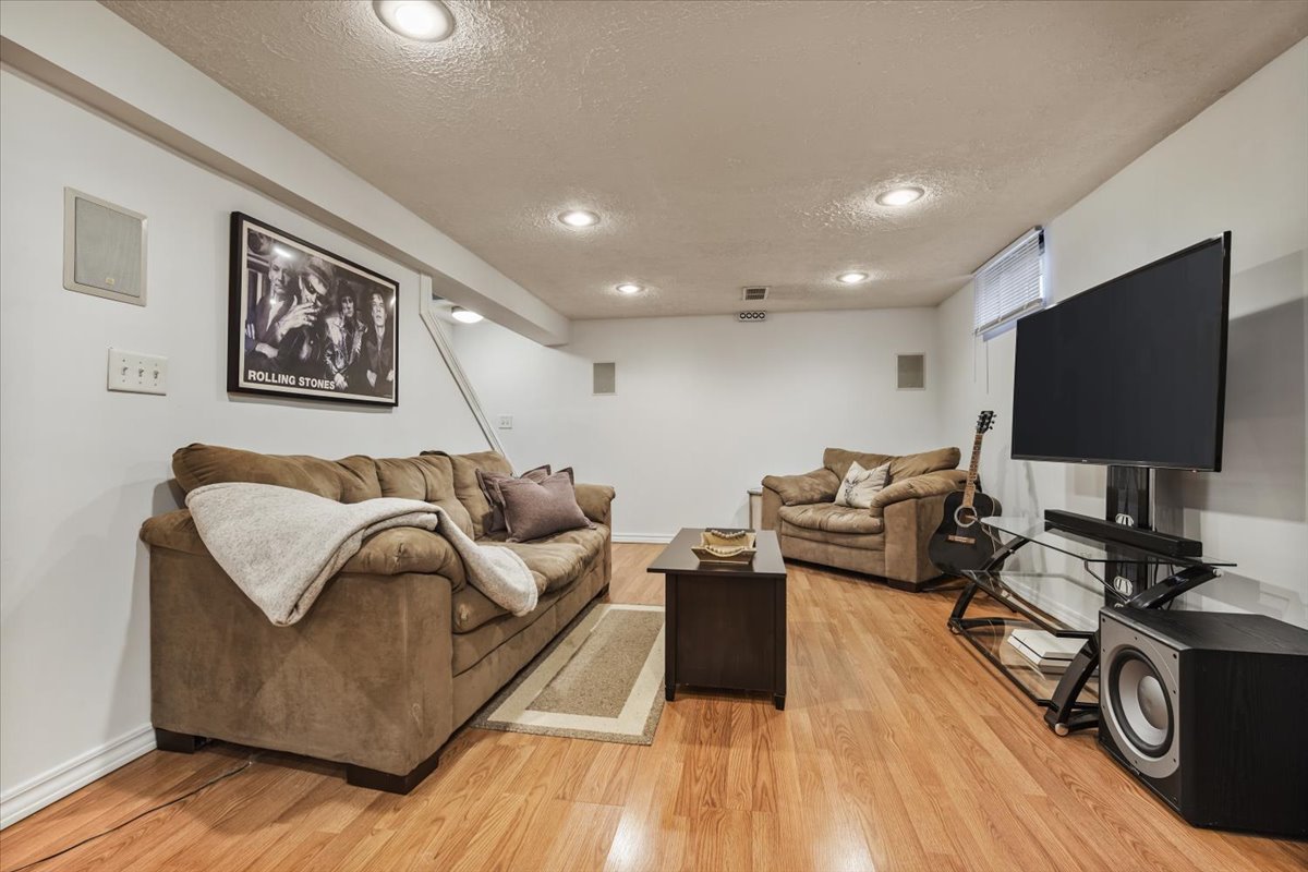 2 Yew Court Bloomington, IL 61701 - Photo 19 of 27 a living room with furniture and a flat screen tv