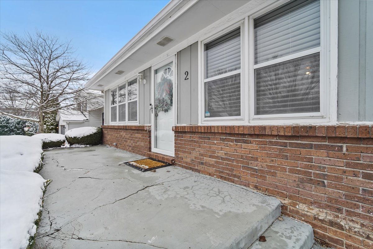 2 Yew Court Bloomington, IL 61701 - Photo 2 of 27 a view of a brick house with many windows