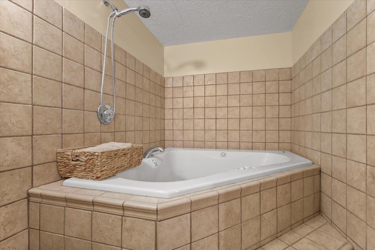 2 Yew Court Bloomington, IL 61701 - Photo 24 of 27 a bathroom with a sink and shower