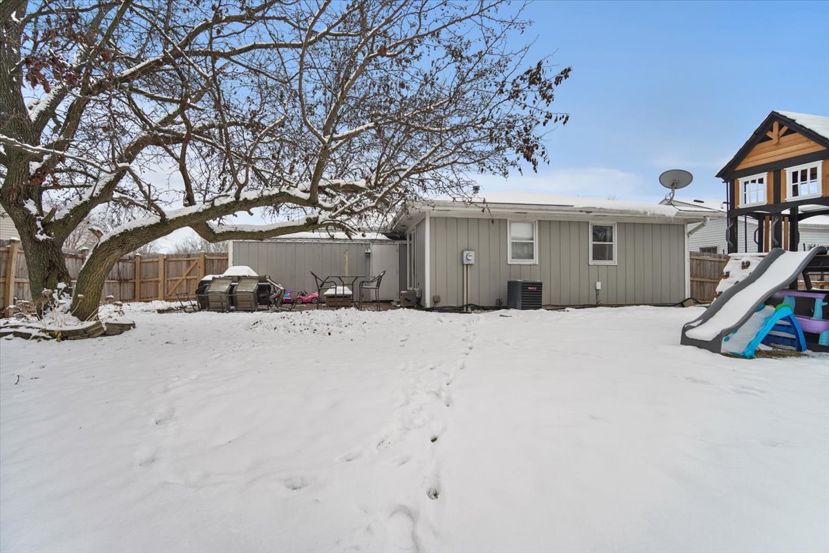 2 Yew Court Bloomington, IL 61701 - Photo 27 of 27 a view of a house with a snow in the yard