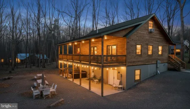 a backyard of a house with outdoor seating