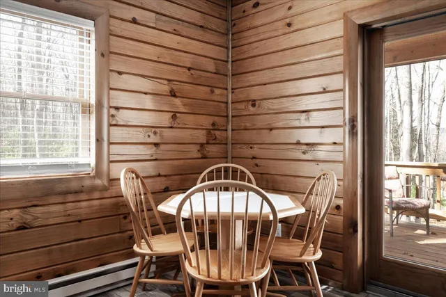 a view of a room that has a wooden bench in it