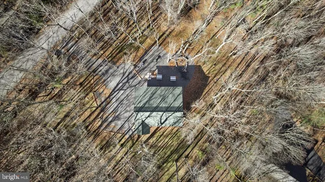 a picture of a bathroom with a shower and a mirror