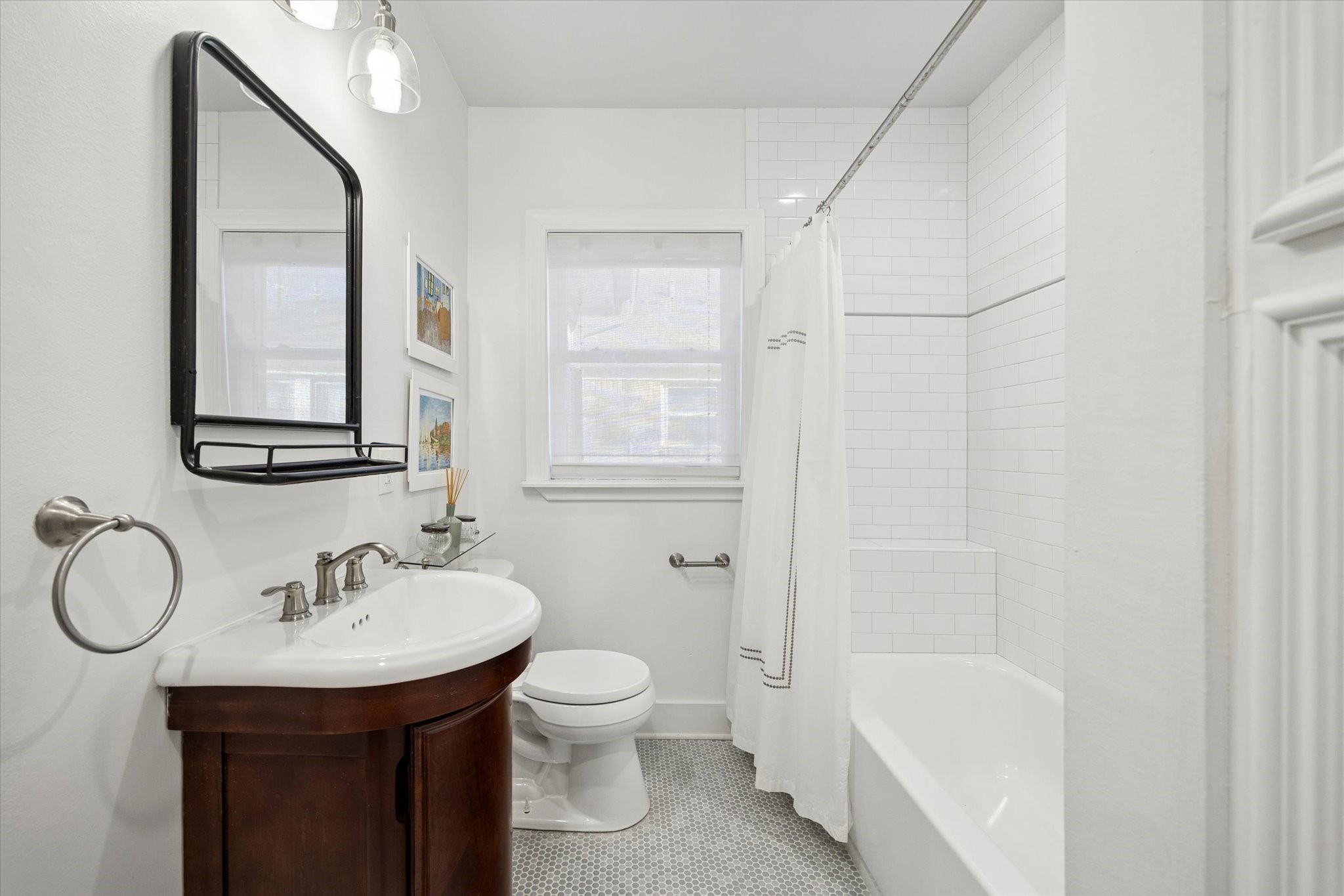 2109 Colquitt Street Houston, TX 77098 - Photo 18 of 28 a bathroom with a sink toilet and shower