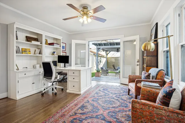 a living room with furniture a rug and a window