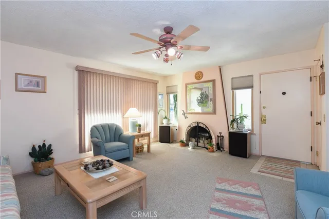 a view of a livingroom with furniture and a chandelier