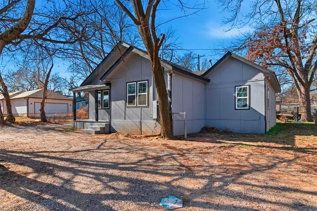 a house with trees in the background